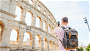 Male traveller taking photo of Colosseum in Italy Rome