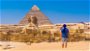 Male traveller looking over Egypt Pyramids and Sphinx in Middle East