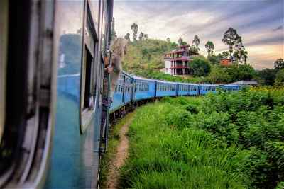 Female traveller in Sri Lankan train in Ella